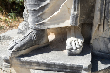 Sandal on stone sculpture in Ancient Corinth Greece