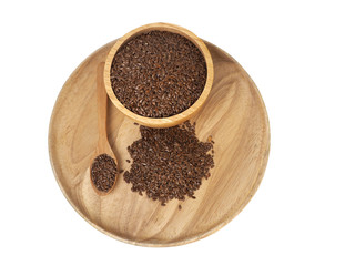 Flax seed placed in a wooden tray, wooden spoon, wooden cup on a white background