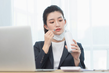 Asian business lady working in the Office，She's not feeling well