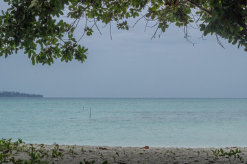 A shot of paradise island white sandy beach and coastline
