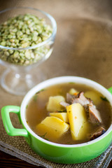 hot pea soup with meat and vegetables in a plate