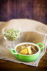 hot pea soup with meat and vegetables in a plate