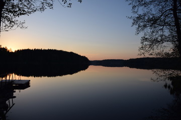 sunset over still lake