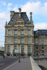 Fototapeta na wymiar Paris, France - August 26, 2019: The Louvre building and the Royal Bridge.