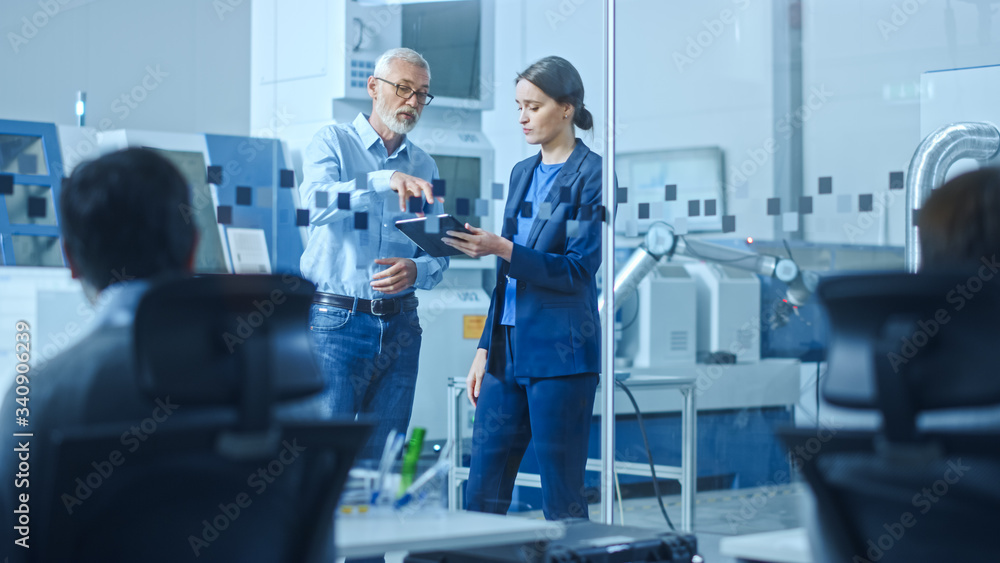 Poster modern factory: female engineer, male project manager standing in high tech development facility, ta