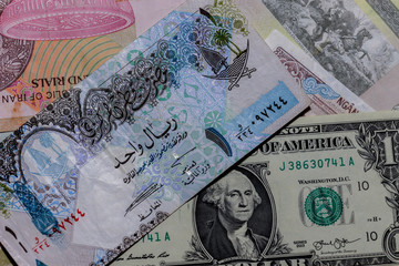 One  US Dollar with Different qatar Banknotes