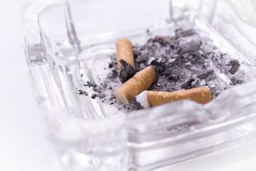 Ashtray with several cigarettes consumed and extinguished