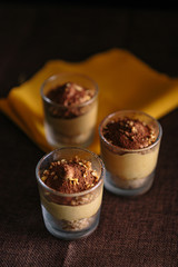 Three glasses with Coffee Cream Recipe, presented as a delicious dessert. dark food