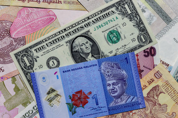Fototapeta na wymiar One US Dollar with Different Malaysian Ringgit Banknotes