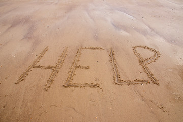 Help written in sand