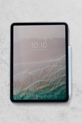 Tablet mockup on white marble table
