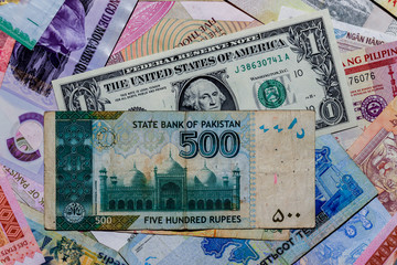 One  US Dollar with Different Pakistani Rupee Banknotes