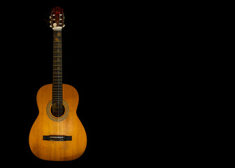 Obraz premium Guitar with six strings on black background