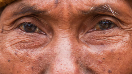 Eyes and part of a face of a Burmese man