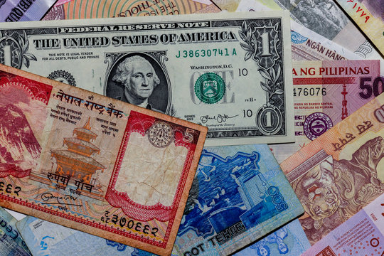 Moscow, Russia - April 20, 2020: One  US Dollar with Different Nepalese Rupee Banknotes