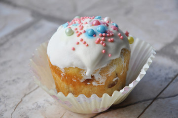 Easter cupcake with icing and sprinkles