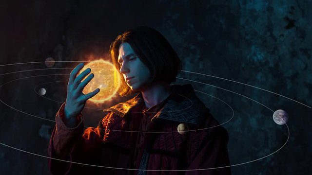 Nicholas Copernicus author of the heliocentric system of the world, the scientific revolution. History of scientific progress. A young man in the image of a scientist, holding the sun in his hand
