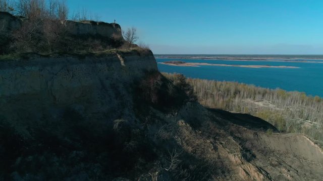Abandoned clay quarry with unusual relief near river Dnipro. Aerial top view