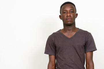 Portrait of young African man looking at camera
