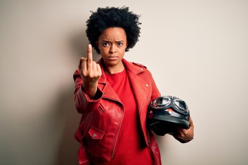 Young African American afro motorcyclist woman with curly hair holding motorcycle helmet Showing...