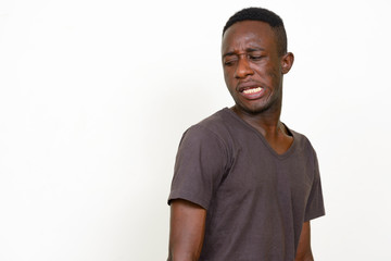 Portrait of stressed young African man looking disgusted