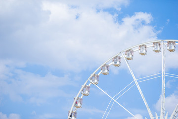 Fototapeta premium Ferris wheel Roue de Paris on the Place de la Concorde from Tuileries Garden