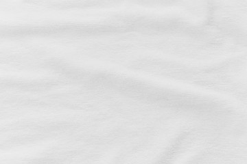 Close-up of white fabric texture background. Abstract crumpled cloth.