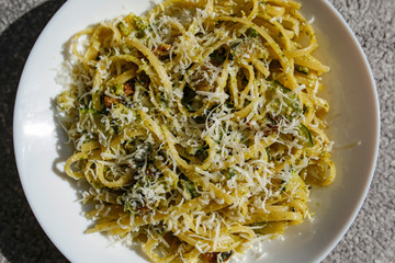 pasta spaghetti with green pesto sauce