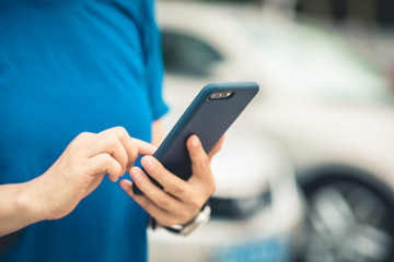 Asian woman using smartphone outdoors