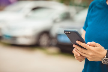 Asian woman using smartphone at city