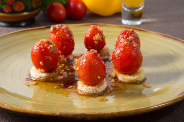 Salted red cherry tomatoes on bread