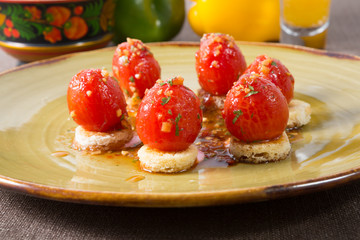 Salted red cherry tomatoes on bread