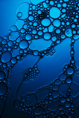 dark blue liquid closeup, abstract chemistry background