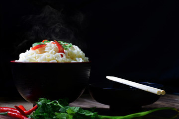 line  noodle  chopsticks and coriander fresh chilli have smoke ready eat. place on wood table have pattern luxury in darkroom