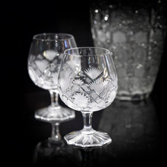 Set of crystal glasses on a dark background