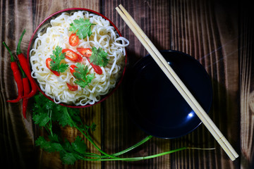 line  noodle  chopsticks and coriander fresh chilli have smoke ready eat. place on wood table have pattern luxury