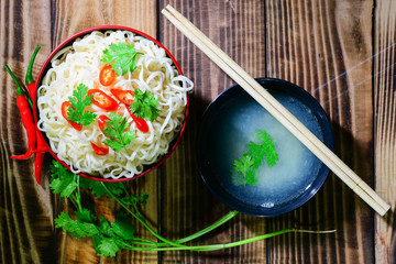 line  noodle  chopsticks and coriander fresh chilli have smoke ready eat. place on wood table have pattern luxury