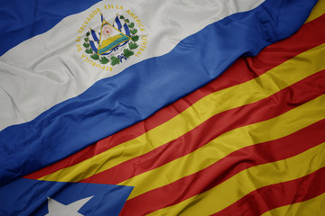 waving colorful flag of catalonia and national flag of el salvador.