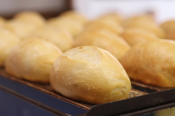 French bread coming out of hot oven, traditional brazilian bread.