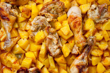 Baked potato with chicken cooked in an electric oven. Background for cooking.