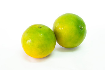 Fresh green tangerine on white background. selective focus, soft focus.