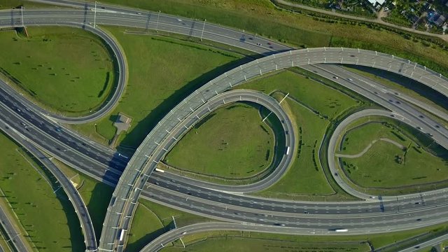 Hyperlapse multilevel road junction Petersburg modern traffic intersection. Russia epic freeway. Many cars fast movement smooth oval twist. Travel Logistics Driving. Metropolis overpopulation. Aerial