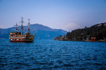Ancient traditional japanese boat on the lake Ashi in Hakone and view on the Mount Fuji, Japan