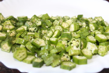 The ladies finger may be cut into round pieces or sliced into four halves or may be put whole in a mix vegetable curry