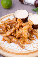 Fried pork ears served on board