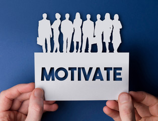Hands holding a motivate white card business team people sign