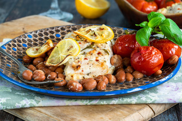 Halibut baked in white wine with borlotti beans and tomatoes