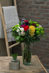 Flower bouquet in a vase in interior
