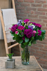 Flower bouquet in a vase in interior