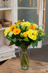 Flower bouquet in a vase in interior